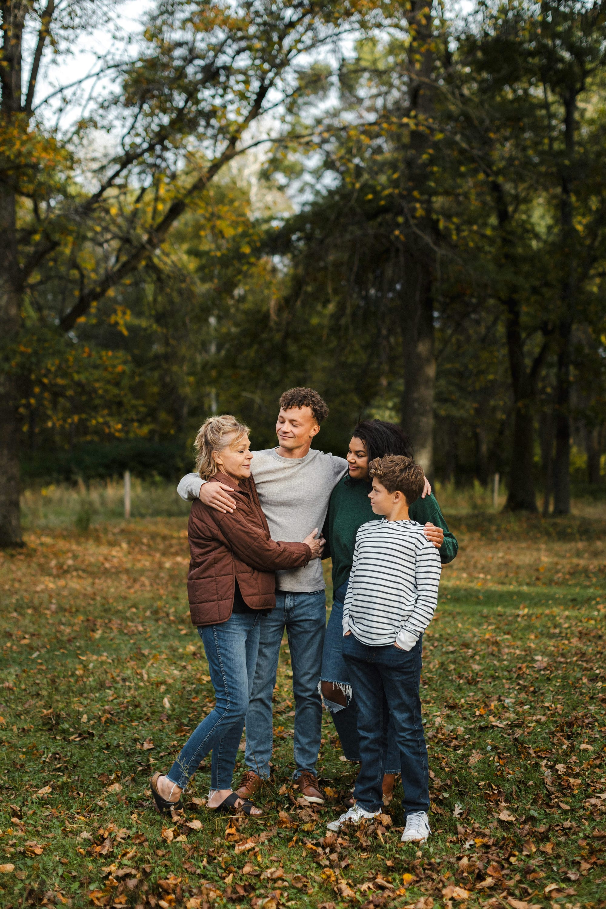 A family outdoors, supporting each other