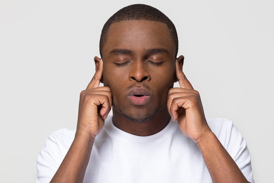 An adult overwhelmed by stress and anxiety