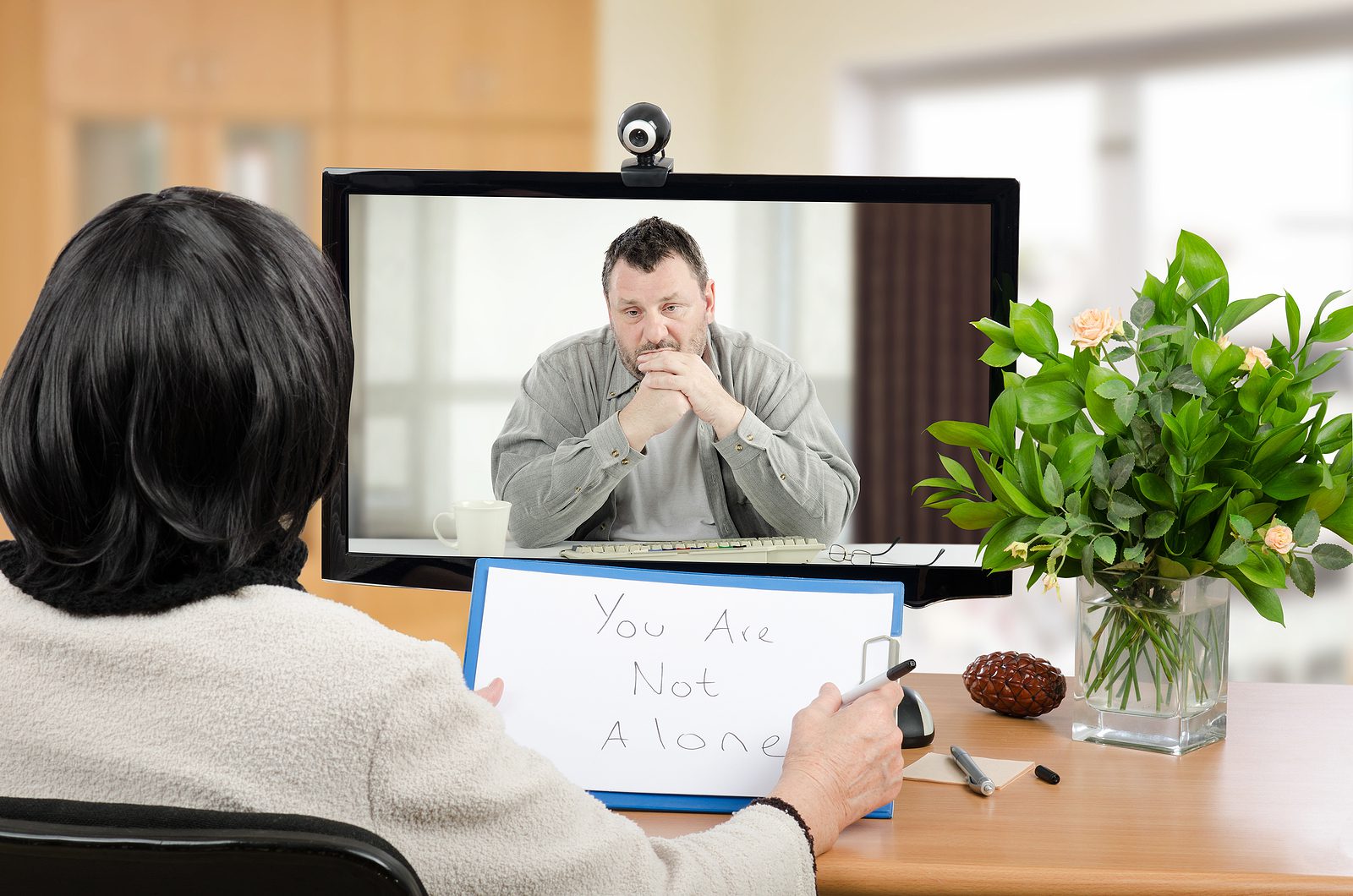 A person attending a Psycamore virtual therapy session from home